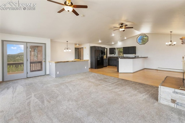 517 Drees Dr, Florissant, CO 80816 - unfurnished living room featuring ceiling fan, light carpet, lofted ceiling, a chandelier, and a baseboard heating unit