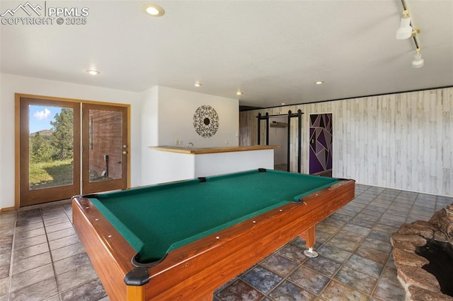517 Drees Dr, Florissant, CO 80816 - game room featuring billiards, a barn door, stone finish flooring, recessed lighting, and track lighting