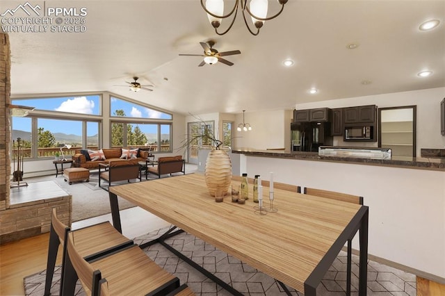 517 Drees Dr, Florissant, CO 80816 - dining area with vaulted ceiling, a ceiling fan, a chandelier, a mountain view, and recessed lighting