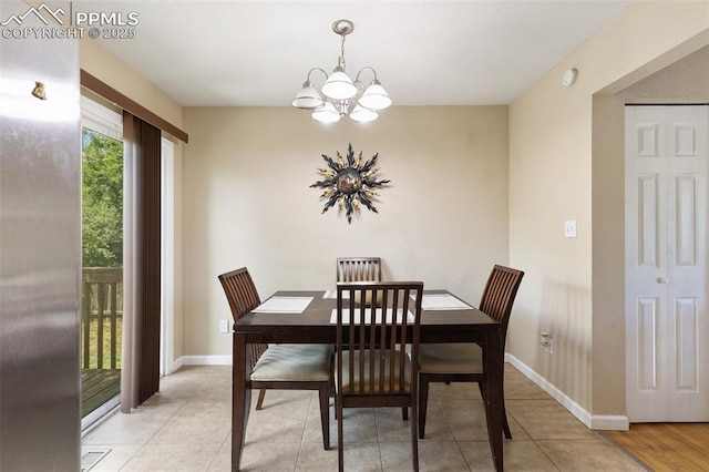 614 Bickley St, Colorado Springs, CO 80911 - dining space with a chandelier and light tile patterned floors