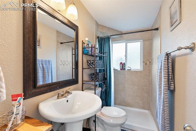 614 Bickley St, Colorado Springs, CO 80911 - full bathroom with a textured wall and a tile shower
