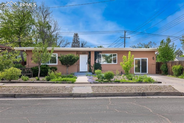 1406 N Foote Ave, Colorado Springs, CO 80909 - ranch-style home with stucco siding and driveway