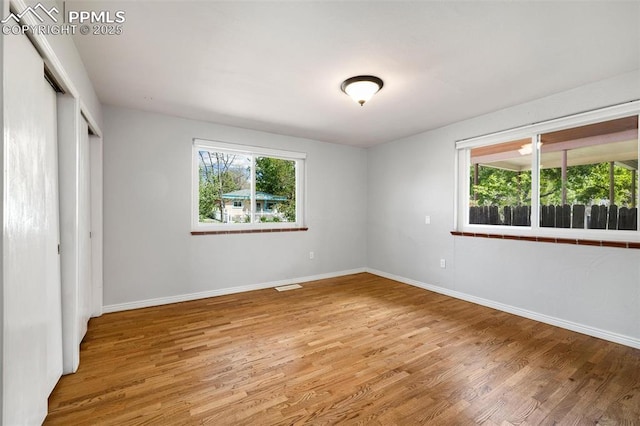 1406 N Foote Ave, Colorado Springs, CO 80909 - unfurnished bedroom with light wood finished floors and a closet