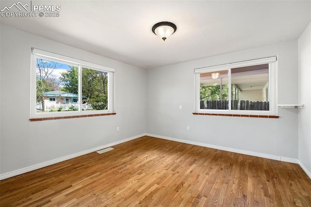 1406 N Foote Ave, Colorado Springs, CO 80909 - empty room featuring wood finished floors and baseboards
