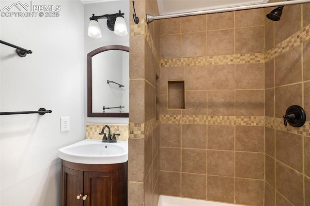 1406 N Foote Ave, Colorado Springs, CO 80909 - full bathroom featuring a tile shower, vanity, and backsplash