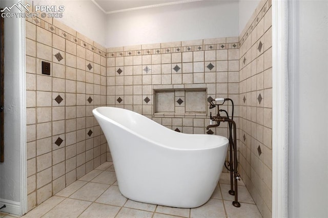 1406 N Foote Ave, Colorado Springs, CO 80909 - bathroom featuring tile walls, a freestanding tub, and tile patterned flooring