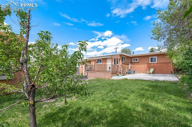 1406 N Foote Ave, Colorado Springs, CO 80909 - rear view of house with a patio area, a yard, and stucco siding