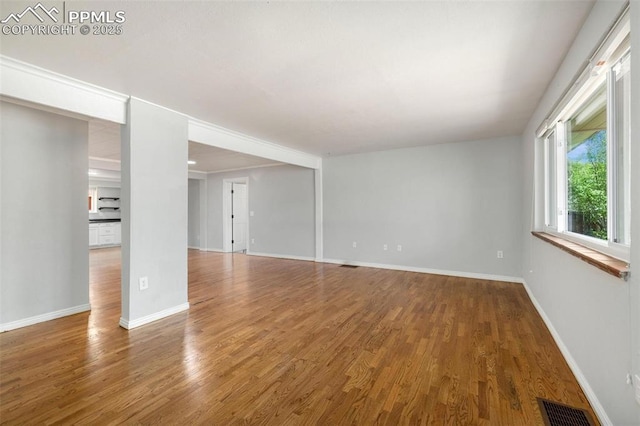 1406 N Foote Ave, Colorado Springs, CO 80909 - empty room with wood finished floors and baseboards