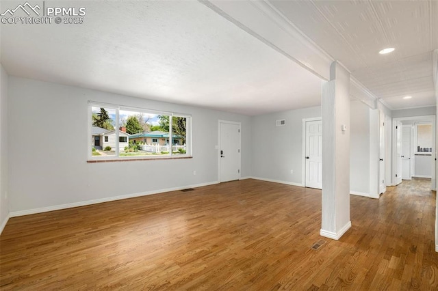 1406 N Foote Ave, Colorado Springs, CO 80909 - unfurnished living room featuring wood finished floors and recessed lighting