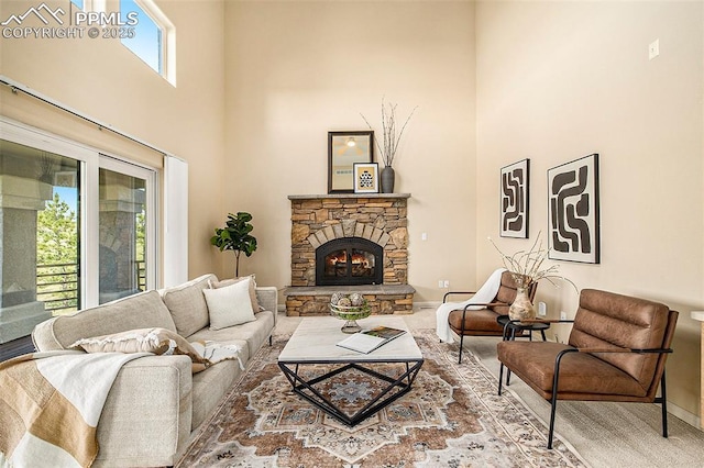 19170 Lochmere Ct, Monument, CO 80132 - living room with a high ceiling, a fireplace, and carpet