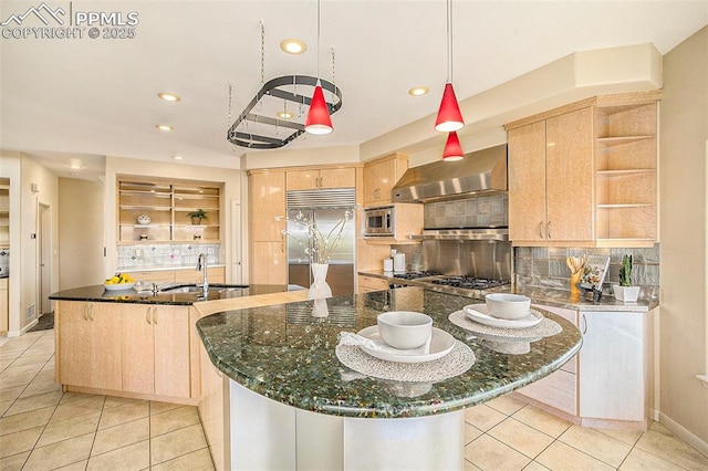 19170 Lochmere Ct, Monument, CO 80132 - kitchen featuring open shelves, built in appliances, wall chimney exhaust hood, light brown cabinets, and recessed lighting