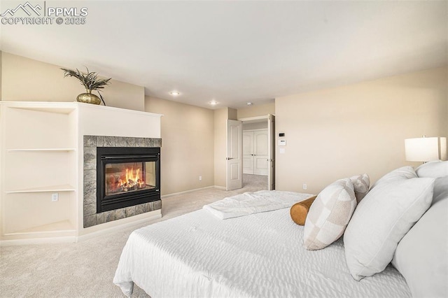 19170 Lochmere Ct, Monument, CO 80132 - bedroom featuring light colored carpet and a tiled fireplace
