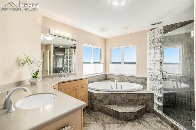 19170 Lochmere Ct, Monument, CO 80132 - full bathroom with double vanity, a shower stall, a garden tub, and a water view
