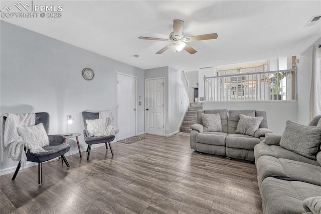 7262 Lone Eagle Ln, Colorado Springs, CO 80925 - living area with wood finished floors, ceiling fan, and stairs