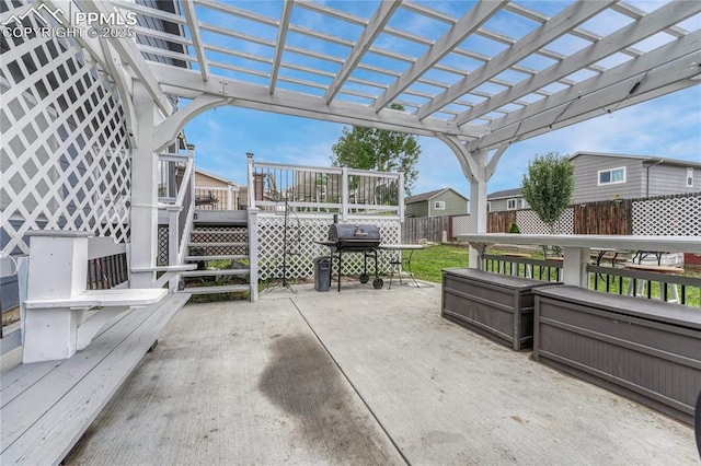 7262 Lone Eagle Ln, Colorado Springs, CO 80925 - fenced backyard with a deck, grilling area, a pergola, and outdoor dining space