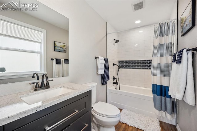 3470 Whimbrel Ln, Colorado Springs, CO 80906 - bathroom with wood finished floors, vanity, and shower / bathtub combination with curtain