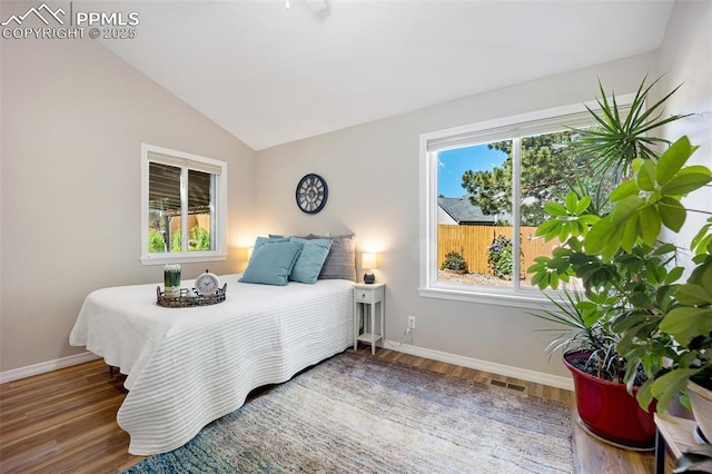 3470 Whimbrel Ln, Colorado Springs, CO 80906 - bedroom featuring wood finished floors and vaulted ceiling