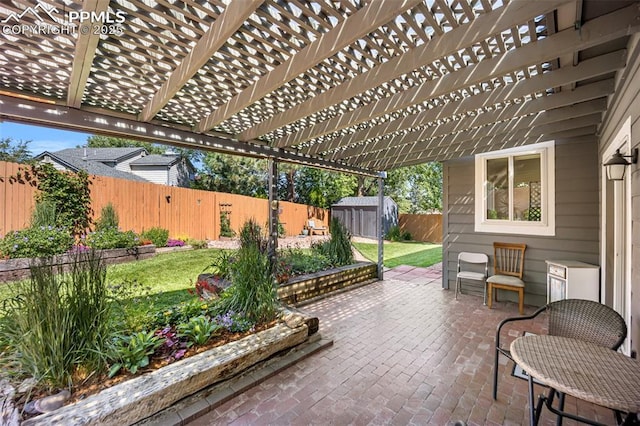 3470 Whimbrel Ln, Colorado Springs, CO 80906 - fenced backyard with a storage unit, a patio, and a pergola