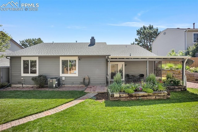3470 Whimbrel Ln, Colorado Springs, CO 80906 - back of property with a patio area, a shingled roof, and a chimney