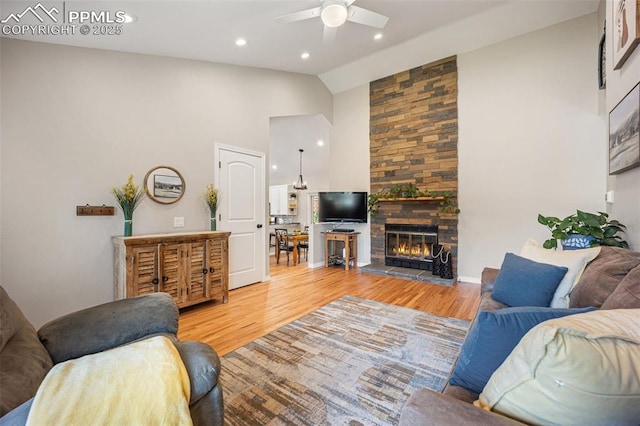3470 Whimbrel Ln, Colorado Springs, CO 80906 - living area featuring high vaulted ceiling, a ceiling fan, wood finished floors, a fireplace, and recessed lighting