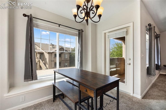 7104 Ash Creek Hts Unit 203, Colorado Springs, CO 80922 - carpeted dining space with baseboards and a chandelier