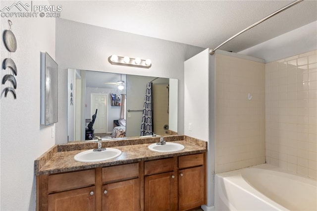 7104 Ash Creek Hts Unit 203, Colorado Springs, CO 80922 - ensuite bathroom with double vanity, ceiling fan, and shower / bathtub combination with curtain