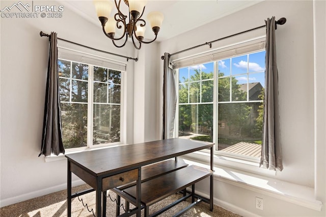 7104 Ash Creek Hts Unit 203, Colorado Springs, CO 80922 - dining area featuring a chandelier and plenty of natural light