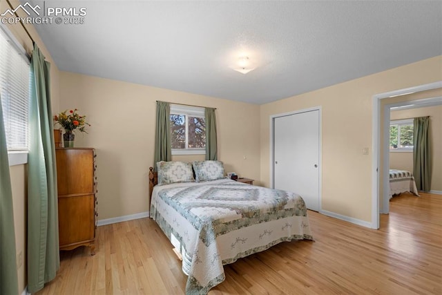 811 N Baldwin St, Woodland Park, CO 80863 - bedroom with light wood-type flooring and baseboards