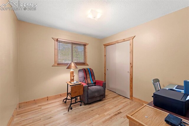 811 N Baldwin St, Woodland Park, CO 80863 - office featuring wood finished floors and a textured ceiling
