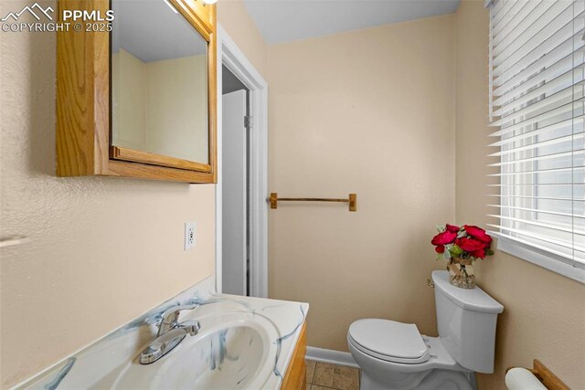 811 N Baldwin St, Woodland Park, CO 80863 - bathroom with vanity and tile patterned flooring
