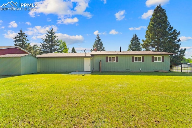 811 N Baldwin St, Woodland Park, CO 80863 - back of house featuring a shed