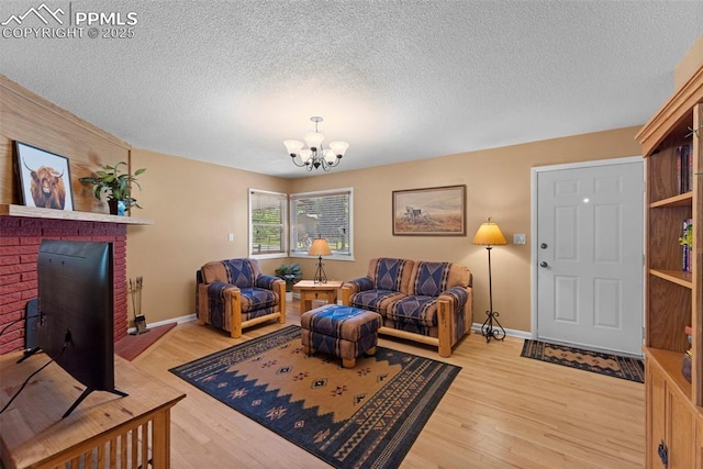 811 N Baldwin St, Woodland Park, CO 80863 - living area featuring a chandelier, light wood finished floors, and a textured ceiling
