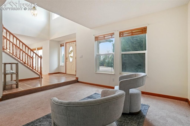 4903 Wainwright Dr, Colorado Springs, CO 80911 - carpeted living area featuring stairway and baseboards
