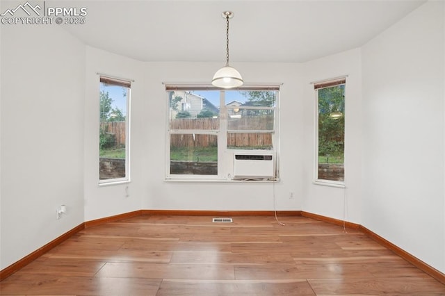 4903 Wainwright Dr, Colorado Springs, CO 80911 - spare room featuring plenty of natural light, hardwood / wood-style flooring, and cooling unit