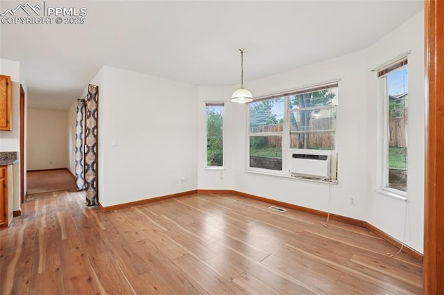 4903 Wainwright Dr, Colorado Springs, CO 80911 - unfurnished dining area featuring cooling unit and light wood-style floors