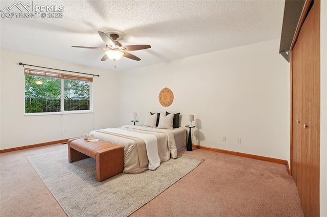 4903 Wainwright Dr, Colorado Springs, CO 80911 - bedroom featuring light colored carpet, a textured ceiling, and ceiling fan