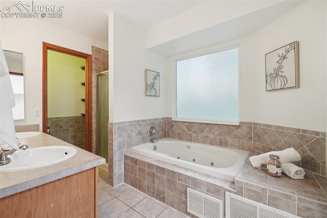 4903 Wainwright Dr, Colorado Springs, CO 80911 - full bathroom with a stall shower, a whirlpool tub, tile patterned floors, and double vanity