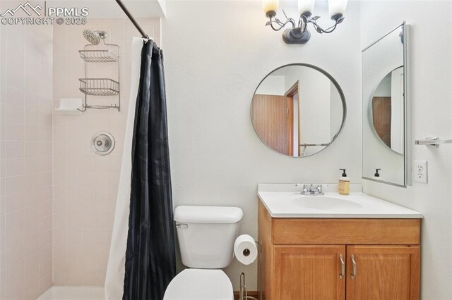 4903 Wainwright Dr, Colorado Springs, CO 80911 - full bath featuring vanity, a chandelier, and tiled shower