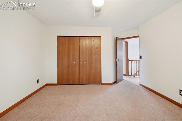 4903 Wainwright Dr, Colorado Springs, CO 80911 - unfurnished bedroom with light colored carpet, a closet, and ceiling fan