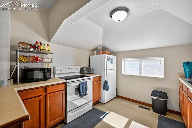 823 N Corona St, Colorado Springs, CO 80903 - kitchen featuring white appliances, lofted ceiling, brown cabinetry, light countertops, and light carpet