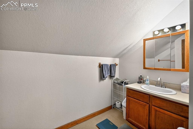 823 N Corona St, Colorado Springs, CO 80903 - bathroom featuring lofted ceiling, a textured ceiling, and vanity