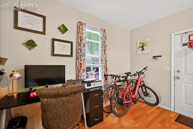 823 N Corona St, Colorado Springs, CO 80903 - living area with light wood finished floors and a desk