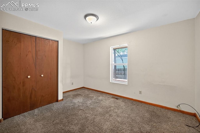 823 N Corona St, Colorado Springs, CO 80903 - unfurnished bedroom with carpet floors and a closet