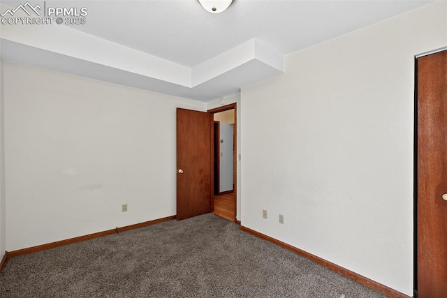 823 N Corona St, Colorado Springs, CO 80903 - carpeted empty room featuring baseboards