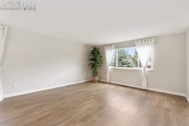4032 E Darby Cir, Colorado Springs, CO 80907 - spare room featuring wood finished floors and baseboards