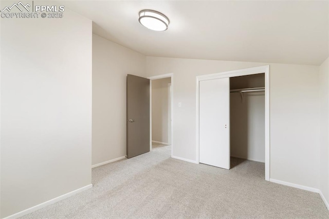 4032 E Darby Cir, Colorado Springs, CO 80907 - unfurnished bedroom featuring lofted ceiling, carpet flooring, and a closet