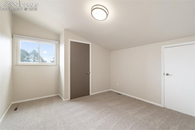 4032 E Darby Cir, Colorado Springs, CO 80907 - additional living space with vaulted ceiling and light colored carpet