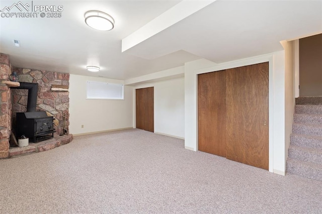 4032 E Darby Cir, Colorado Springs, CO 80907 - finished basement with a wood stove, carpet floors, and stairway