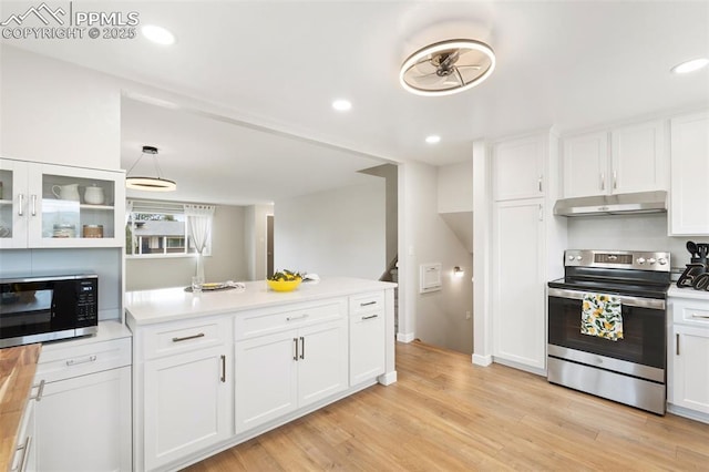 4032 E Darby Cir, Colorado Springs, CO 80907 - kitchen with appliances with stainless steel finishes, under cabinet range hood, white cabinetry, a peninsula, and recessed lighting