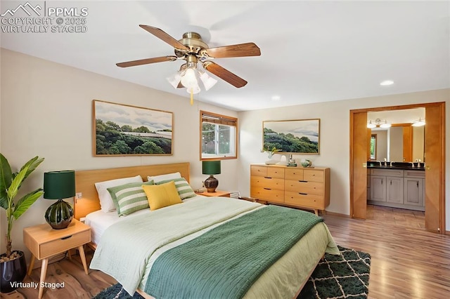 22 Puma Path, Manitou Springs, CO 80829 - bedroom with light wood-type flooring, recessed lighting, connected bathroom, and a ceiling fan